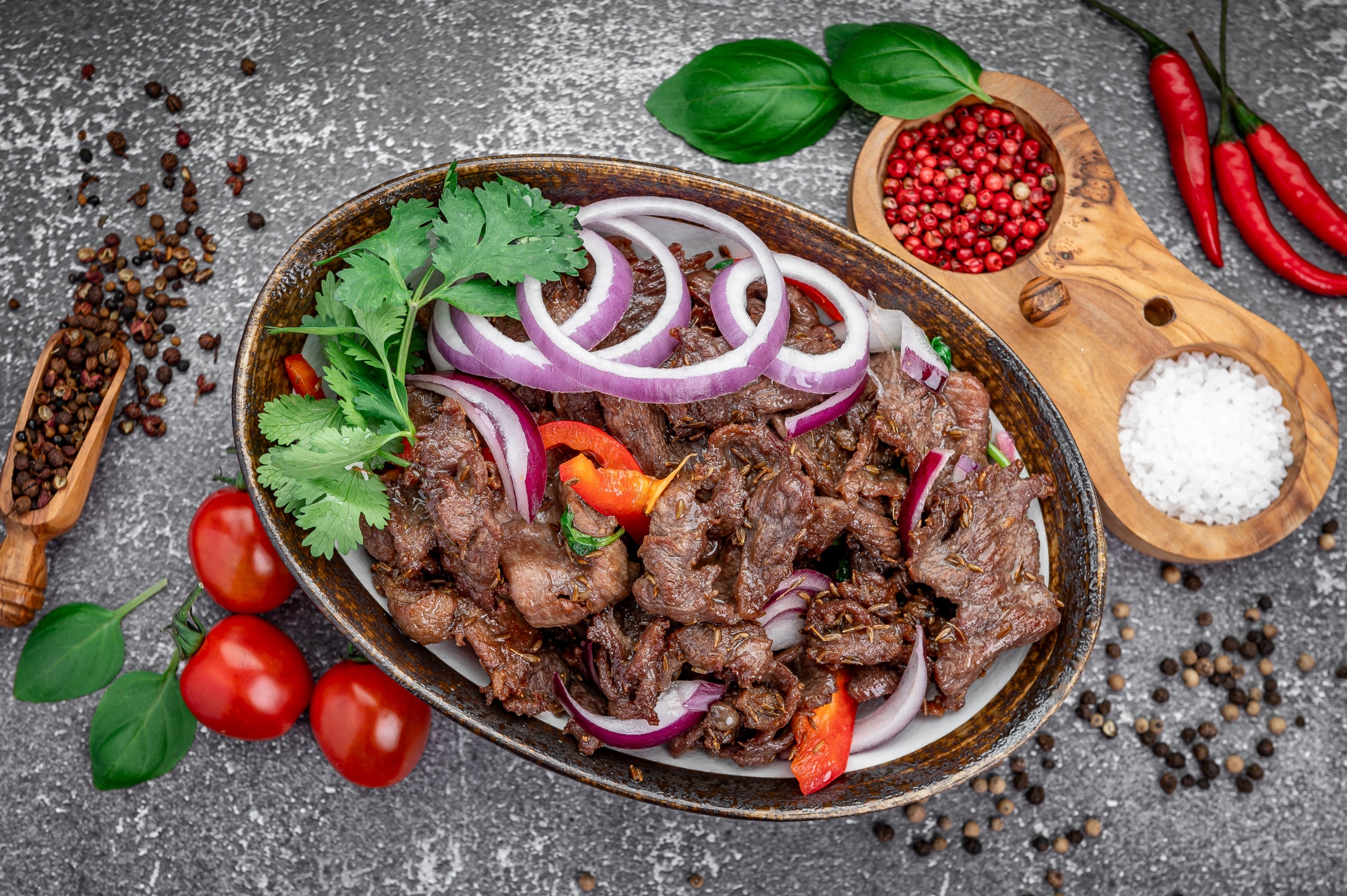 Cumin lamb with peppers plated in the kitchen